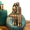 Pareja de enamorados turquesa y dorado